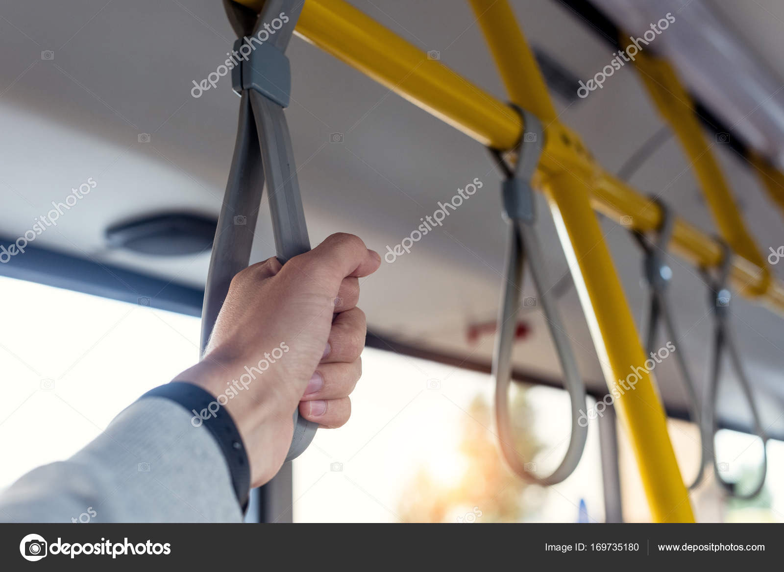 Man holding bus handle — Stock Photo © IgorVetushko 169735180