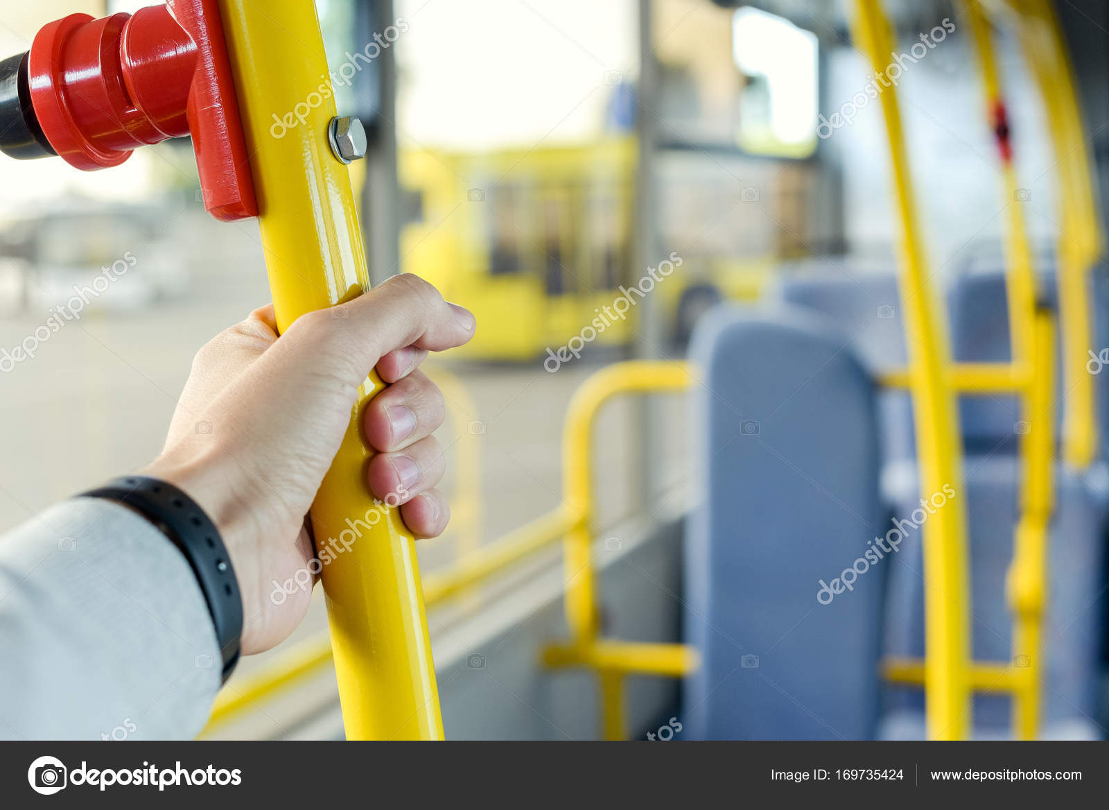 Man holding bus handle ⬇ Stock Photo, Image by © IgorVetushko 169735424