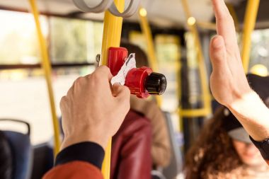 man validating bus ticket