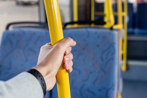 Man holding bus handle — Stock Photo, Image