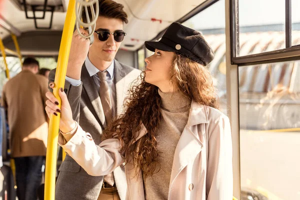 Stylish couple in public transport — Stock Photo, Image