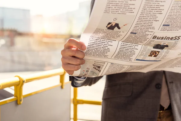 Man with newspaper in bus — Stock Photo, Image