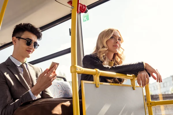 Couple riding in city bus — Stock Photo, Image
