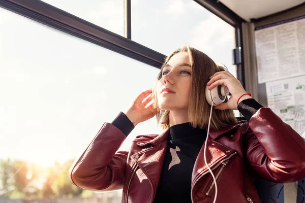 Woman listening music in headphones — Stock Photo, Image