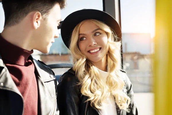 Stylish couple in public transport — Stock Photo, Image