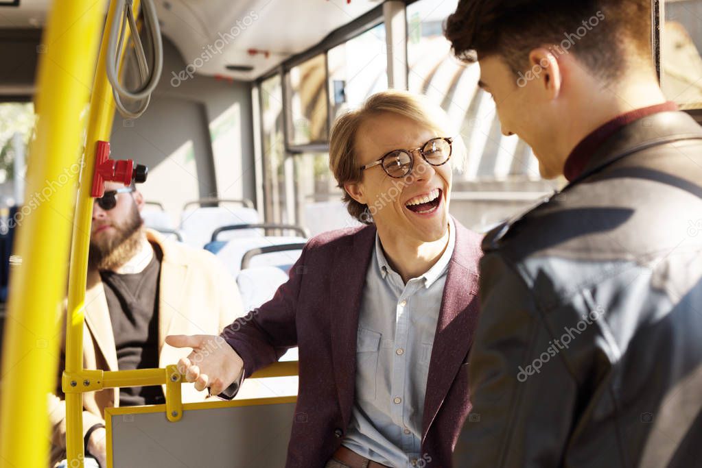 friends having conversation in public transport