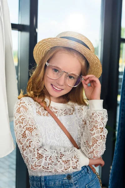 Stylish child in eyeglasses and straw hat — Free Stock Photo