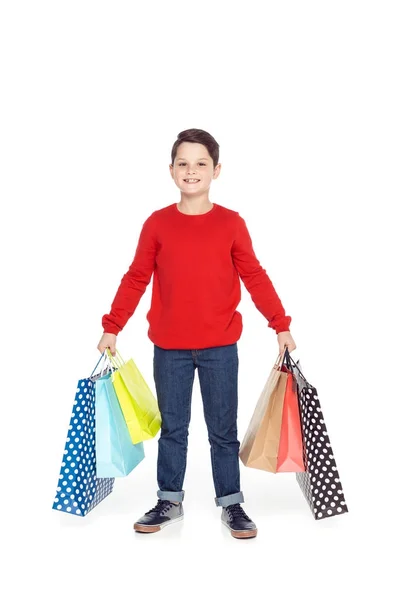 Menino com sacos de compras — Fotografia de Stock