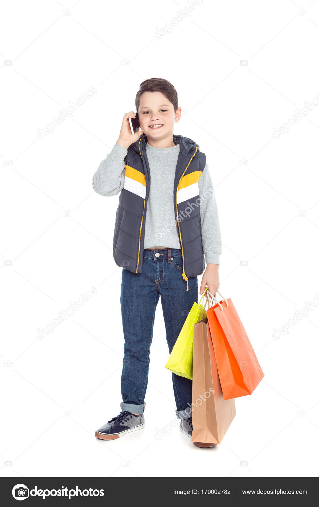 Boy with shopping bags and smartphone — Stock Photo © IgorVetushko