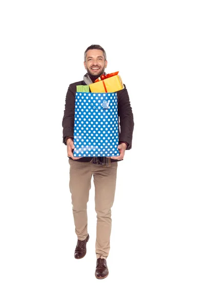 Homme avec sac à provisions et cadeaux — Photo