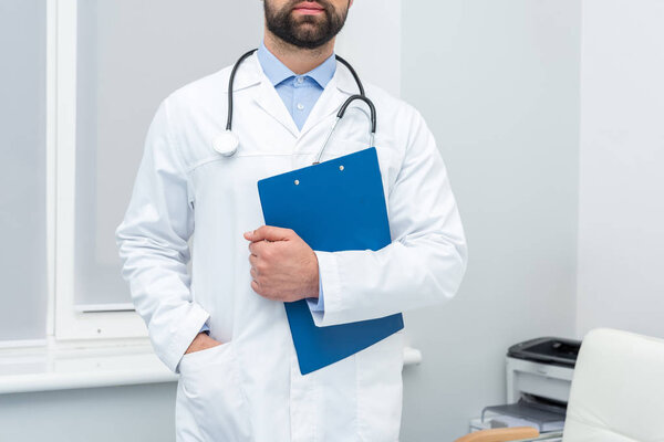 handsome doctor with clipboard