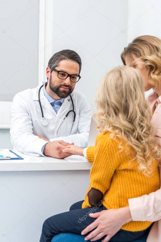 mother and daughter visiting pediatrist