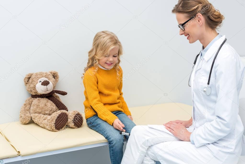 girl doing neurology examination for doctor