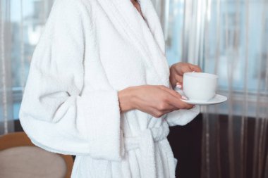 woman in bathrobe drinking coffee clipart