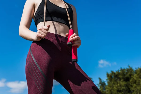 Woman in sportswear with jumping rope — Free Stock Photo