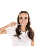 Woman brushing teeth