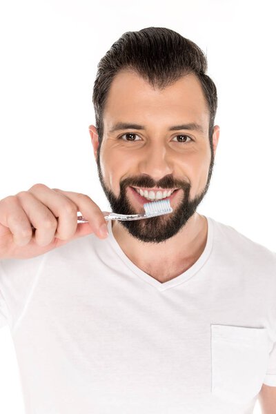 smiling man with toothbrush