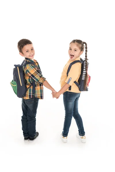Dzieci w wieku szkolnym trzymając się za ręce — Zdjęcie stockowe