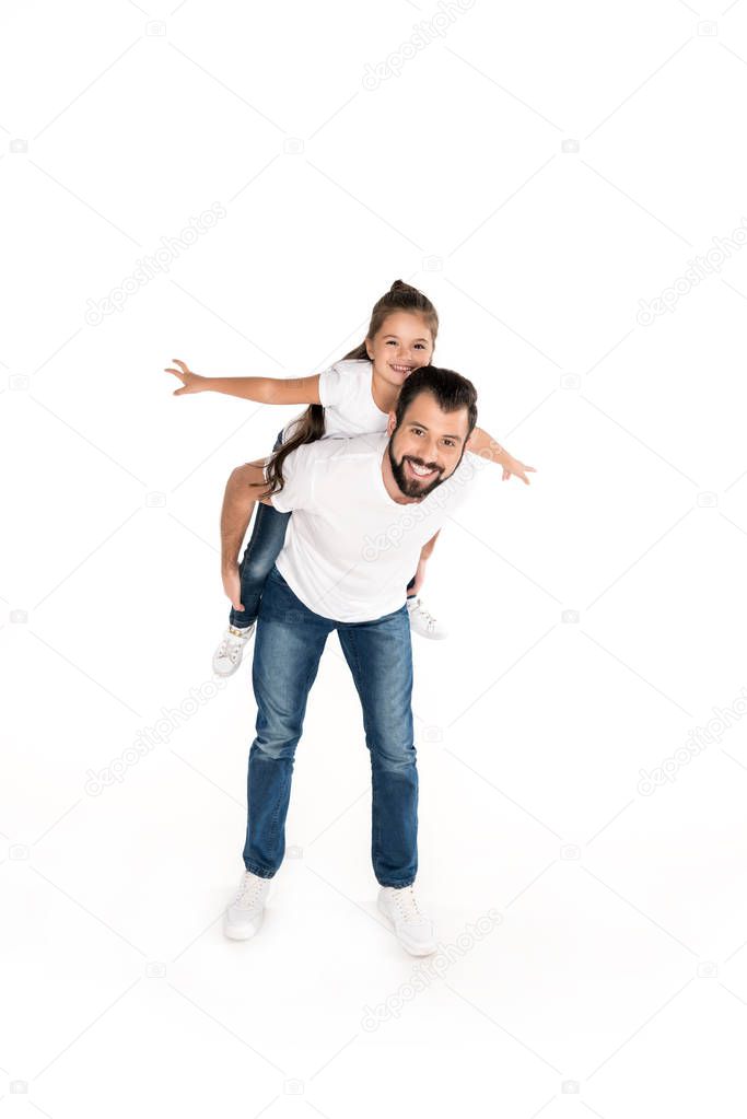 father and daughter piggybacking together