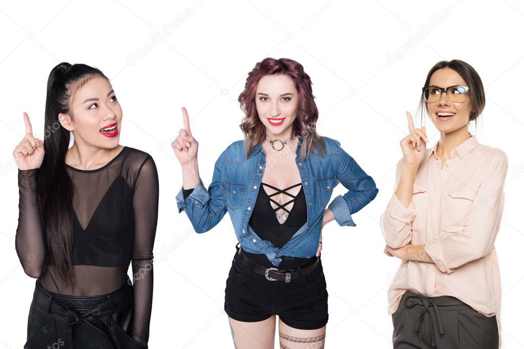 multicultural women pointing up