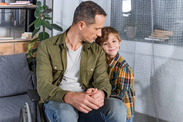 Son and father in wheelchair — Stock Photo, Image