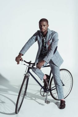 Stylish man riding bicycle clipart