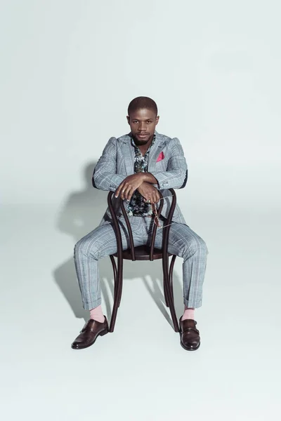 African american man on chair backwards — Stock Photo, Image