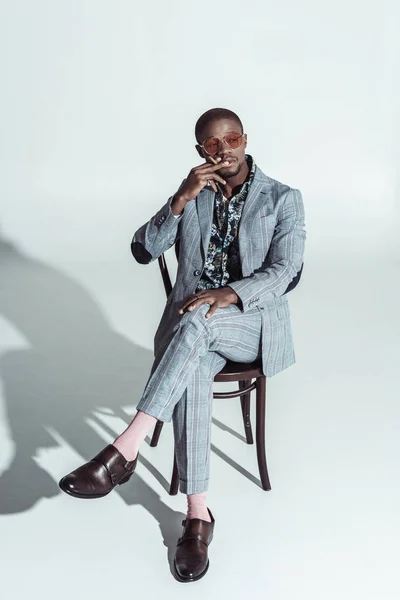 African american man sitting on chair — Stock Photo, Image