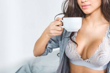 girl in lingerie drinking coffee clipart