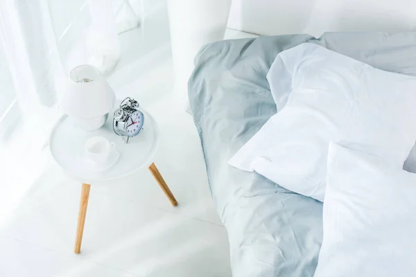 Alarm clock in bedroom — Stock Photo, Image