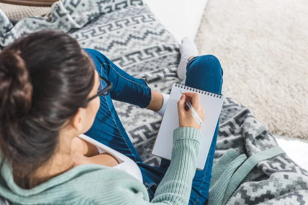 Girl with notebook at home — Stock Photo, Image