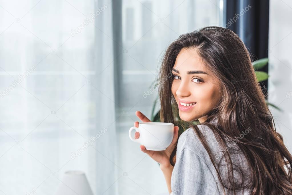 girl drinking coffee at home