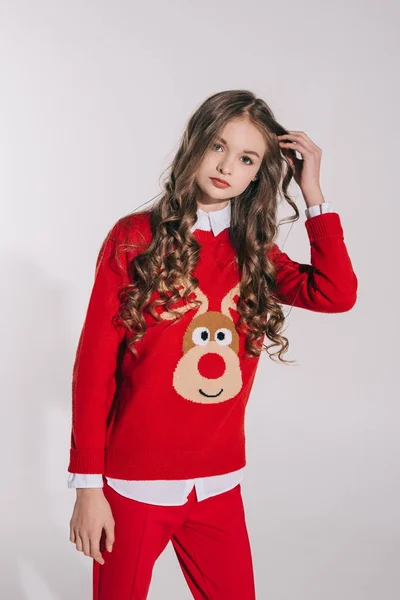 Girl in red sweater with reindeer — Free Stock Photo