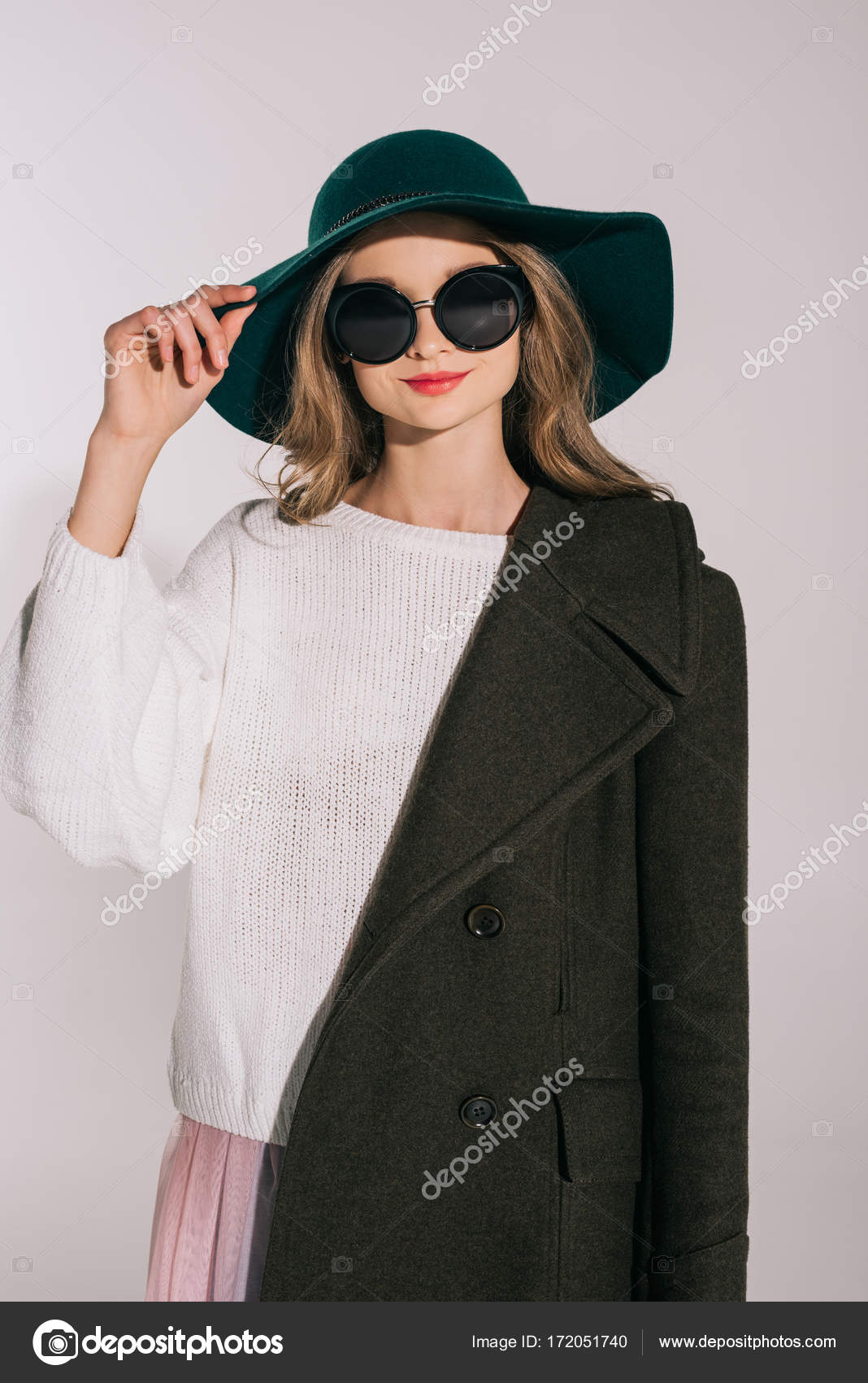 Teenage girl in hat and overcoat — Stock Photo © IgorVetushko #172051740