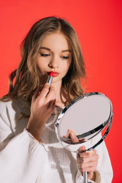 teenage girl applying makeup