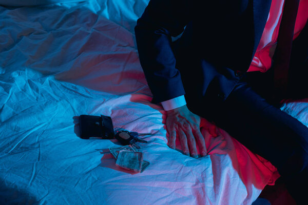 businessman sitting on bed