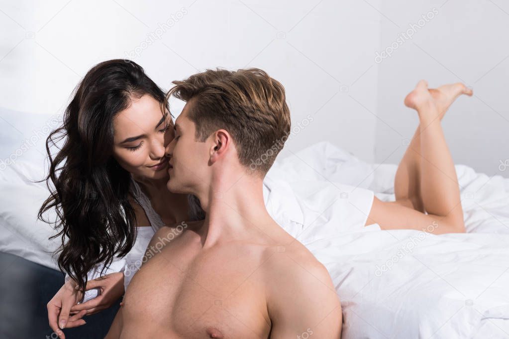 couple cuddling in bed