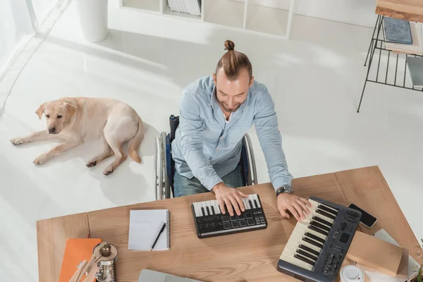 stock image disabled musician working with mpc pads