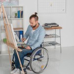 Disabled man painting