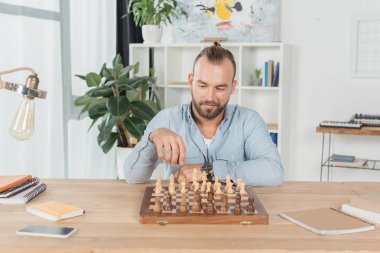 man playing chess with himself clipart