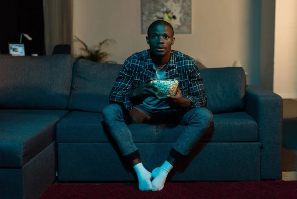 African american man watching tv — Stock Photo, Image