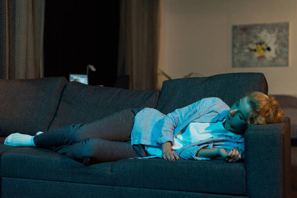 woman sleeping on sofa