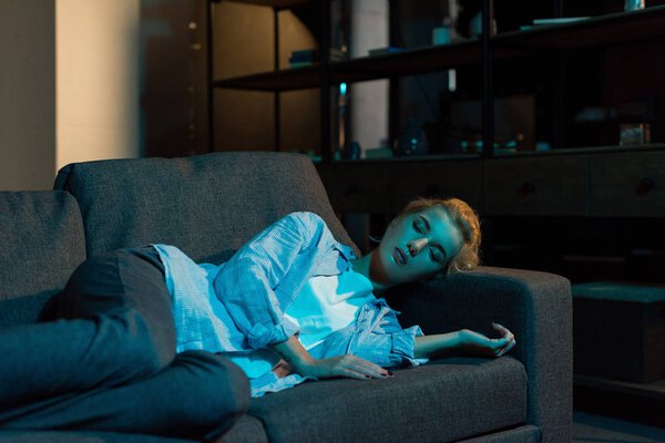 woman sleeping on sofa