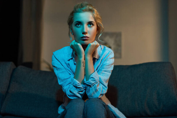 woman watching tv at home