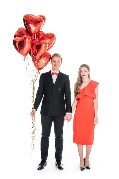 Couple with heart shaped balloons — Stock Photo, Image