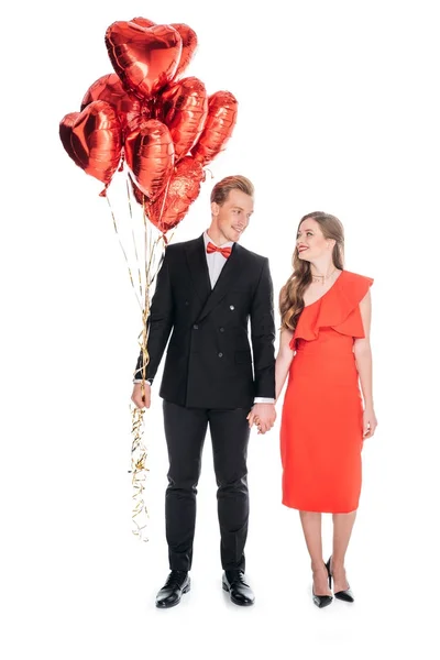 Pareja con globos en forma de corazón — Foto de Stock