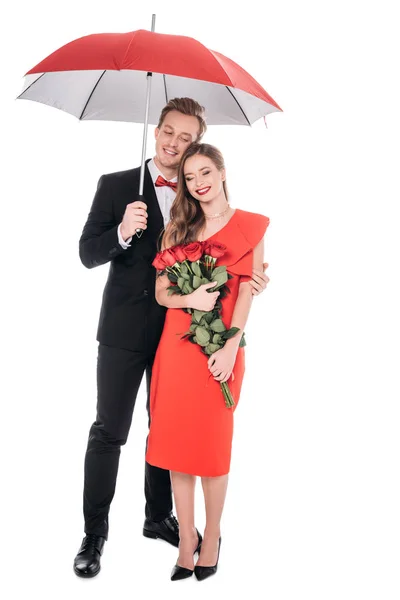 Пара з парасолькою і трояндами — стокове фото
