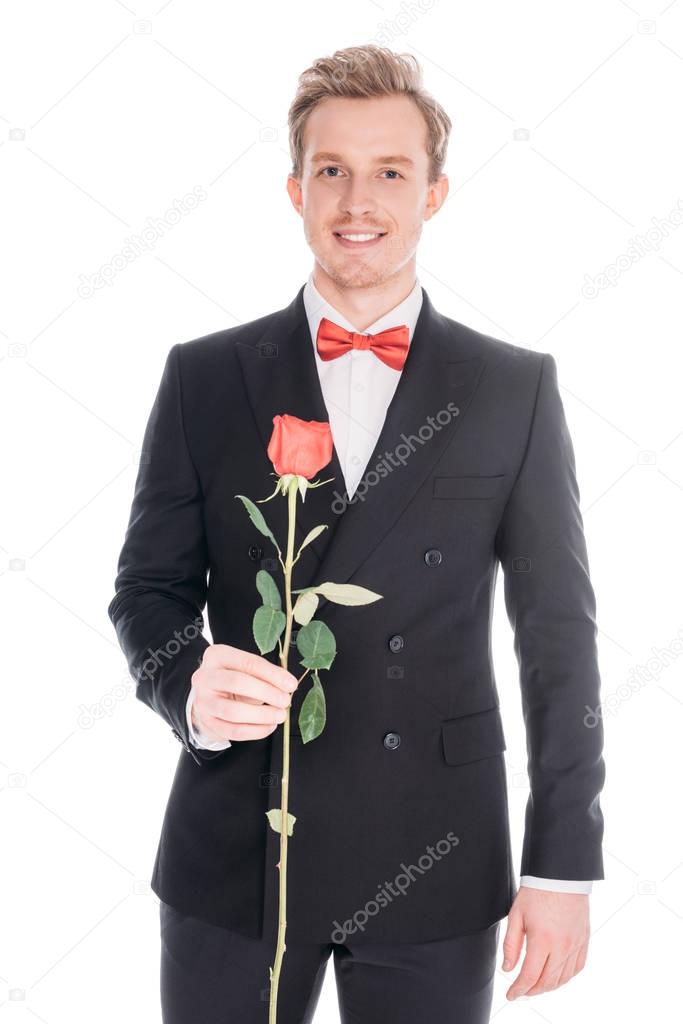 man in suit with rose flower