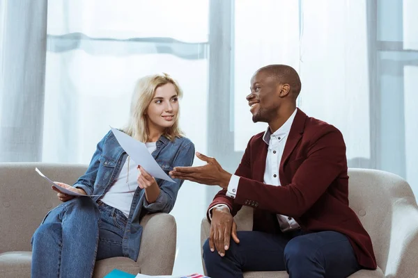 Interracial Photographers Choosing Photos Together While Sitting Armchairs Office — Stock Photo, Image