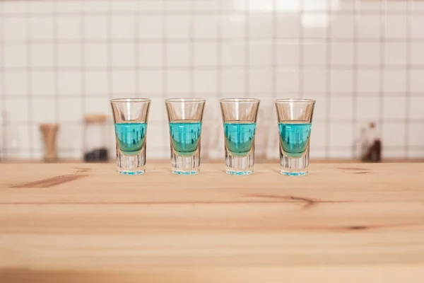 Blue Cocktails Shot Glasses Standing Bar Counter — Stock Photo, Image